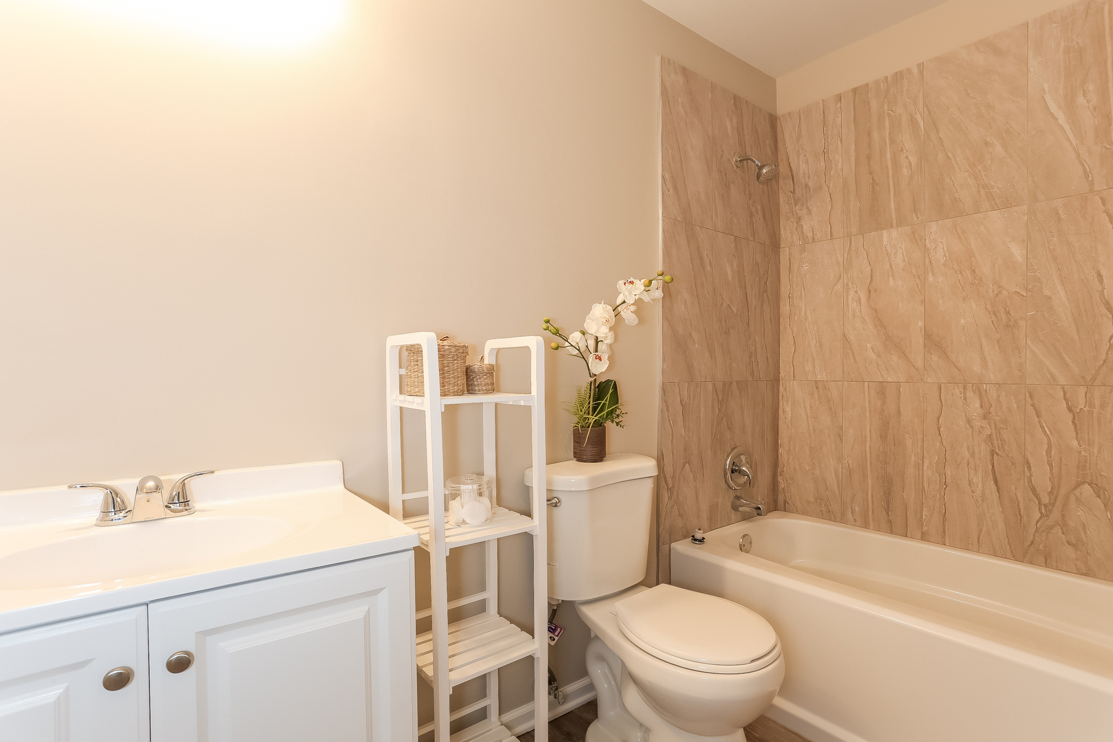 3462 Ravinia Circle Aurora, IL 60504 - Photo 9 of 17 a bathroom with a sink a toilet and shower