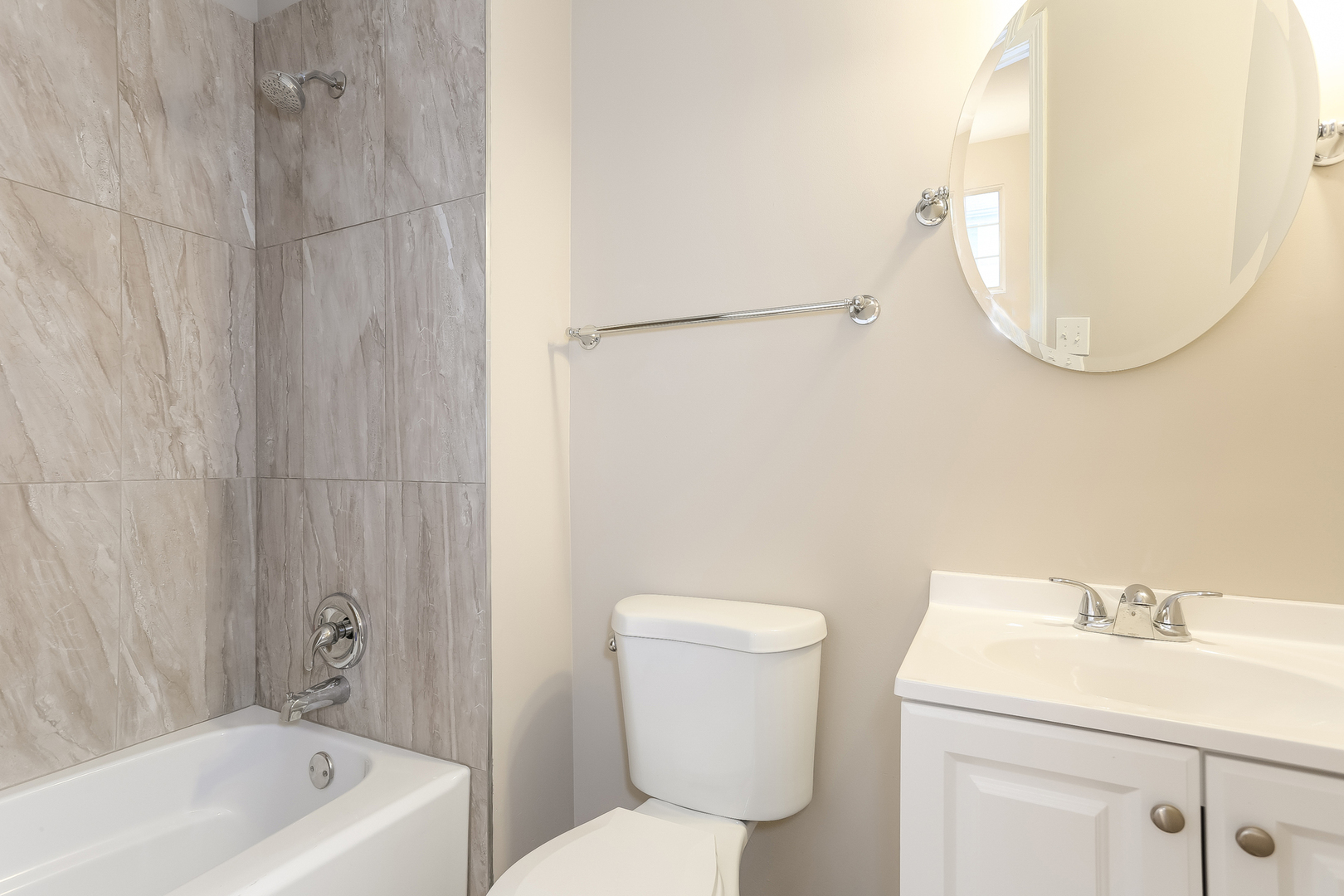 3462 Ravinia Circle Aurora, IL 60504 - Photo 10 of 17 a bathroom with a sink a toilet and a mirror