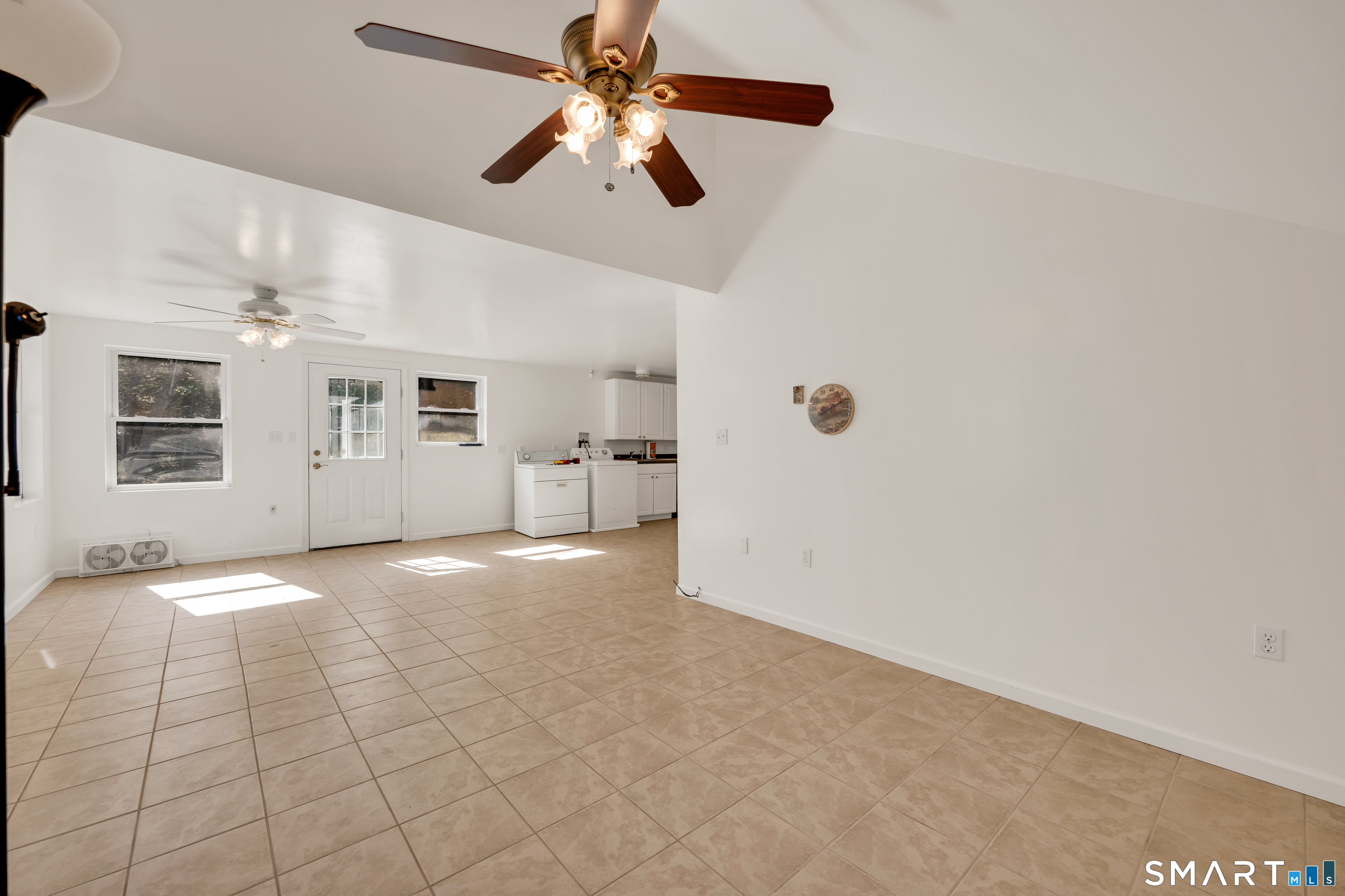 315 West Hill Road Torrington, CT 06790 - Photo 24 of 40 a view of a livingroom with a ceiling fan and window