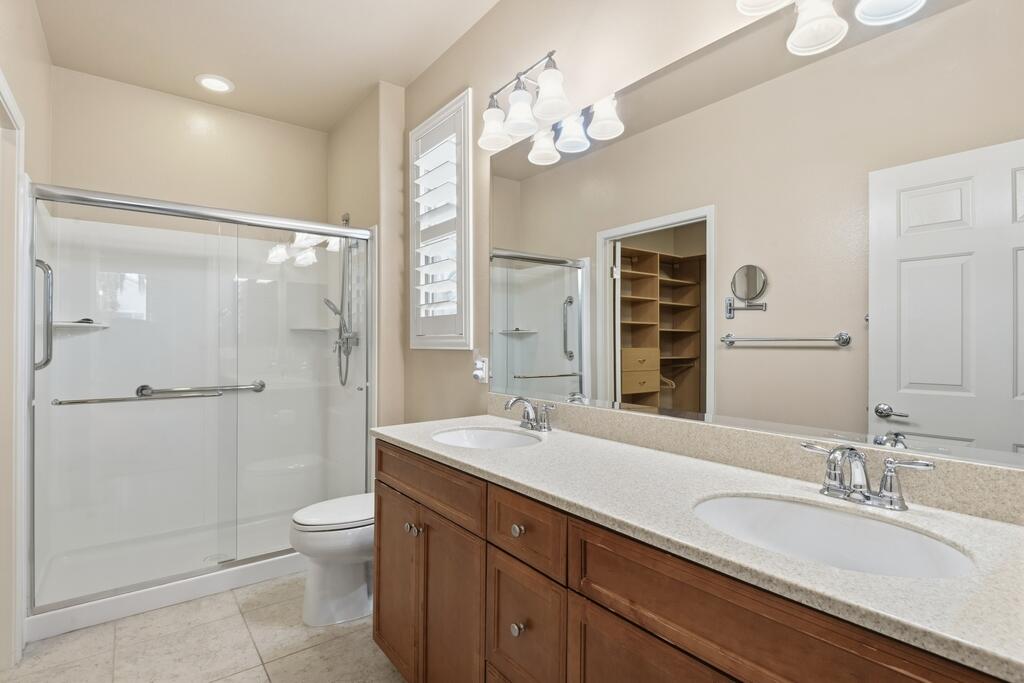 40090 Corte Refugio Indio, CA 92203 - Photo 13 of 50 a bathroom with a sink a toilet and shower