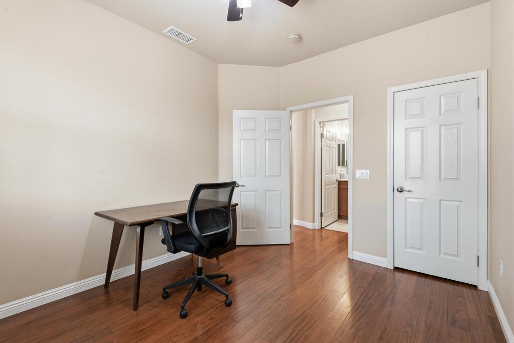 40090 Corte Refugio Indio, CA 92203 - Photo 15 of 50 a view of a workspace with wooden floor and bathroom