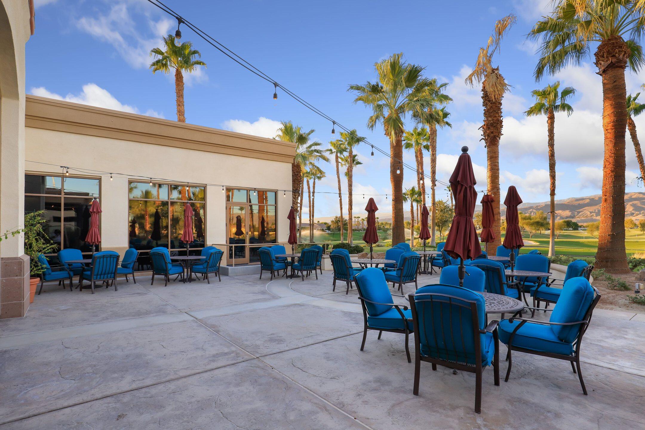 40090 Corte Refugio Indio, CA 92203 - Photo 35 of 50 a view of a patio with dining table and chairs under an umbrella