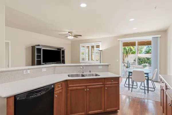 a kitchen with stainless steel appliances a refrigerator and a sink
