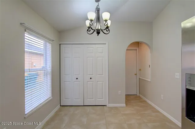 a view of an entryway with chandelier