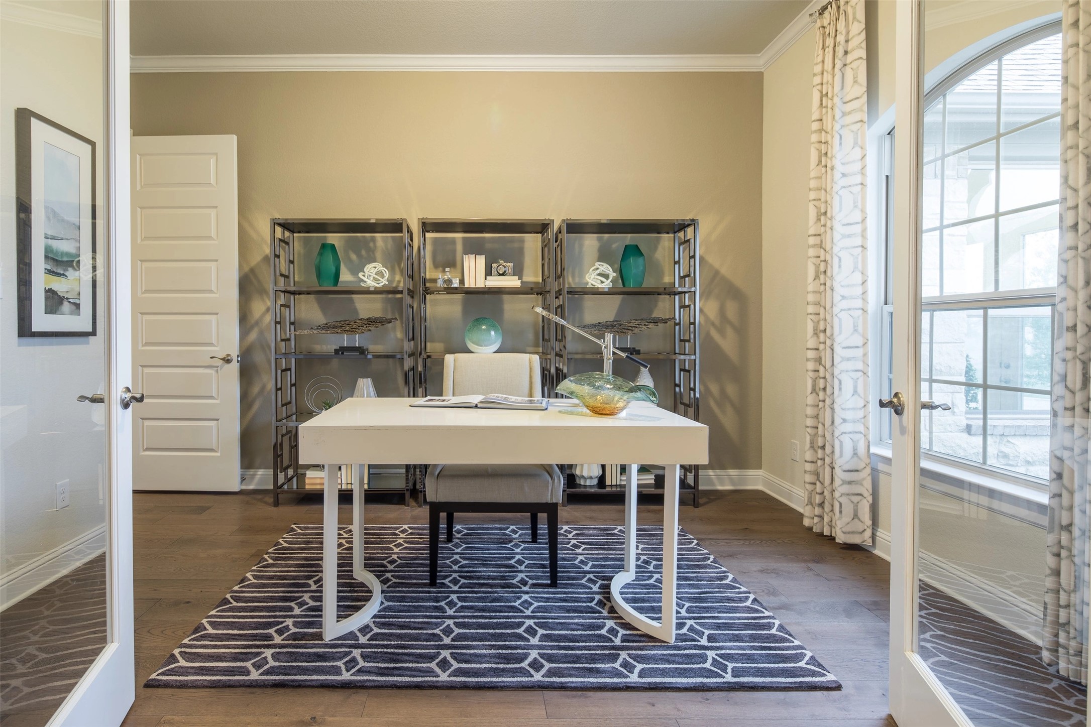 1229 Terrace View Drive Georgetown, TX 78628 - Photo 5 of 17 An airy study with wood flooring and built-in shelving offers a serene workspace.