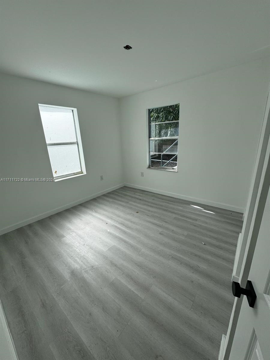 1852 Southwest 22nd Terrace Miami, FL 33145 - Photo 17 of 17 an empty room with windows