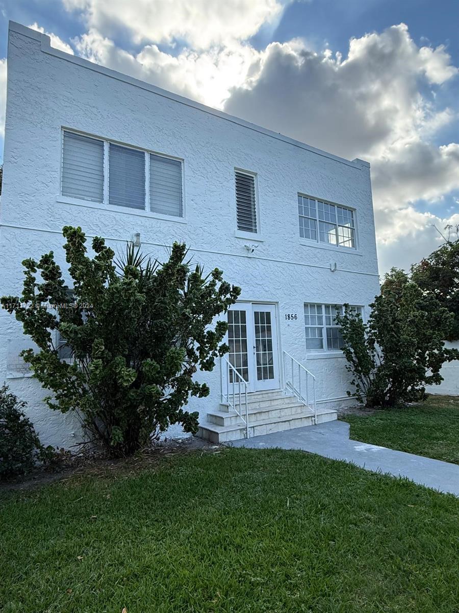 1852 Southwest 22nd Terrace Miami, FL 33145 - Photo 5 of 17 a front view of a house with garden