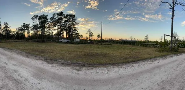 a view of a golf course with a lake view