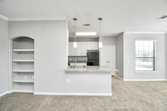 a view of a house with swimming pool and sitting area