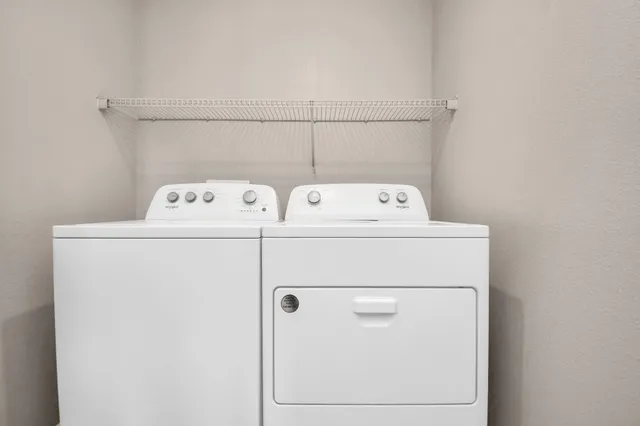 a living room with lots of furniture and a chandelier