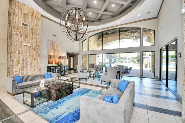 a bathroom with a granite countertop sink mirror and bathtub