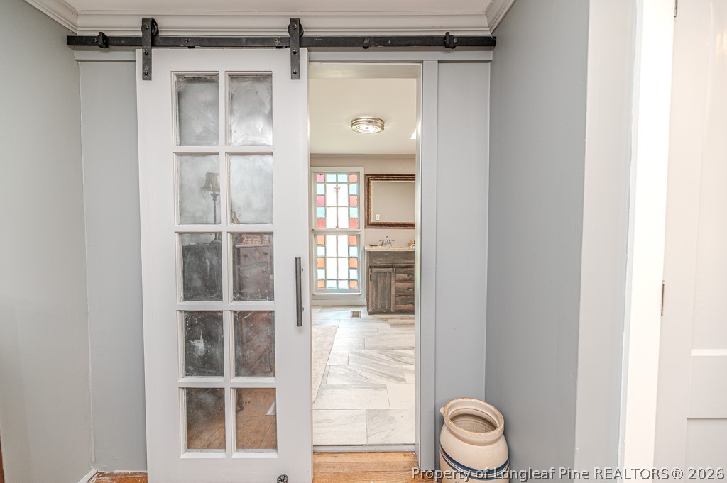 509 Carthage Street Cameron, NC 28326 - Photo 20 of 43 a view of a hallway with wooden shelves