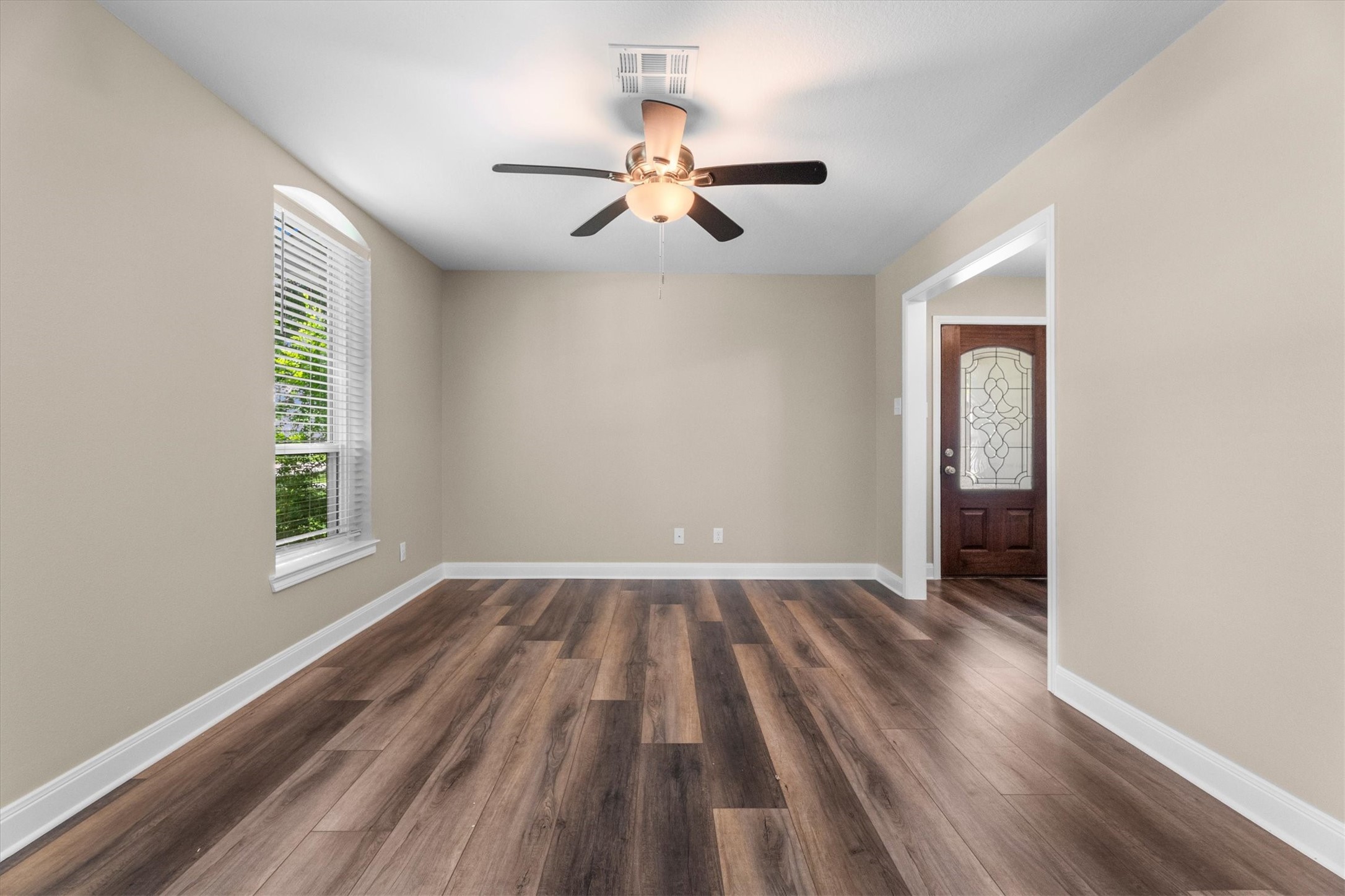 6530 Bayonne Drive Spring, TX 77389 - Photo 12 of 37 wooden floor in an empty room with a window