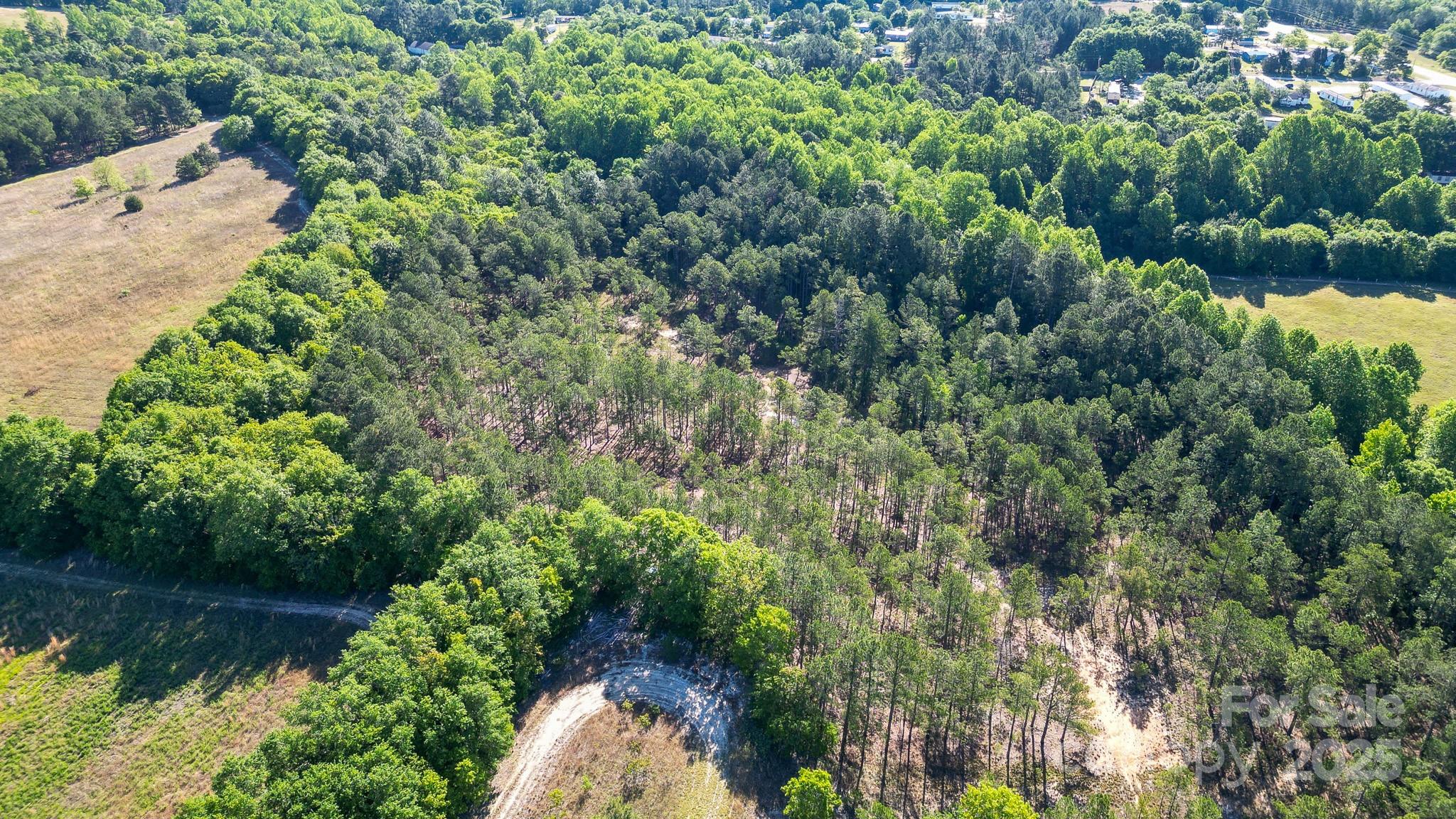 0 Airport Road Pageland, SC 29728 - Photo 40 of 46 an aerial view of residential house with outdoor space and trees all around