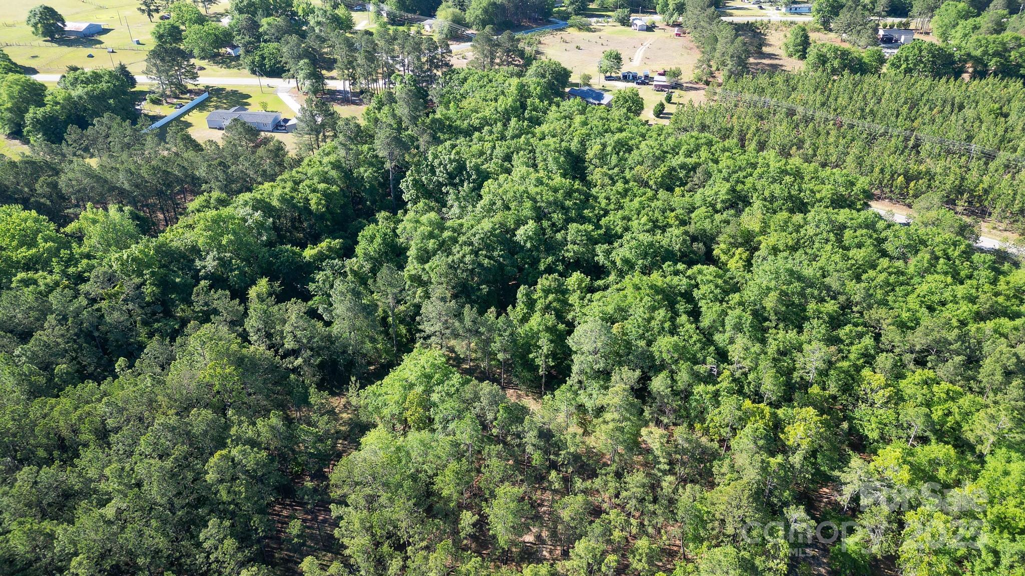 0 Airport Road Pageland, SC 29728 - Photo 42 of 46 an aerial view of residential house with outdoor space and trees all around