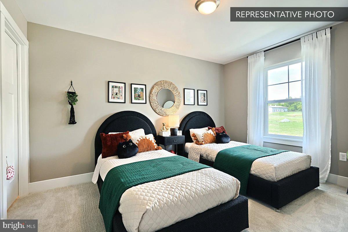 2287 Warrensville Road Montoursville, PA 17754 - Photo 20 of 24 a bedroom with two beds and a window