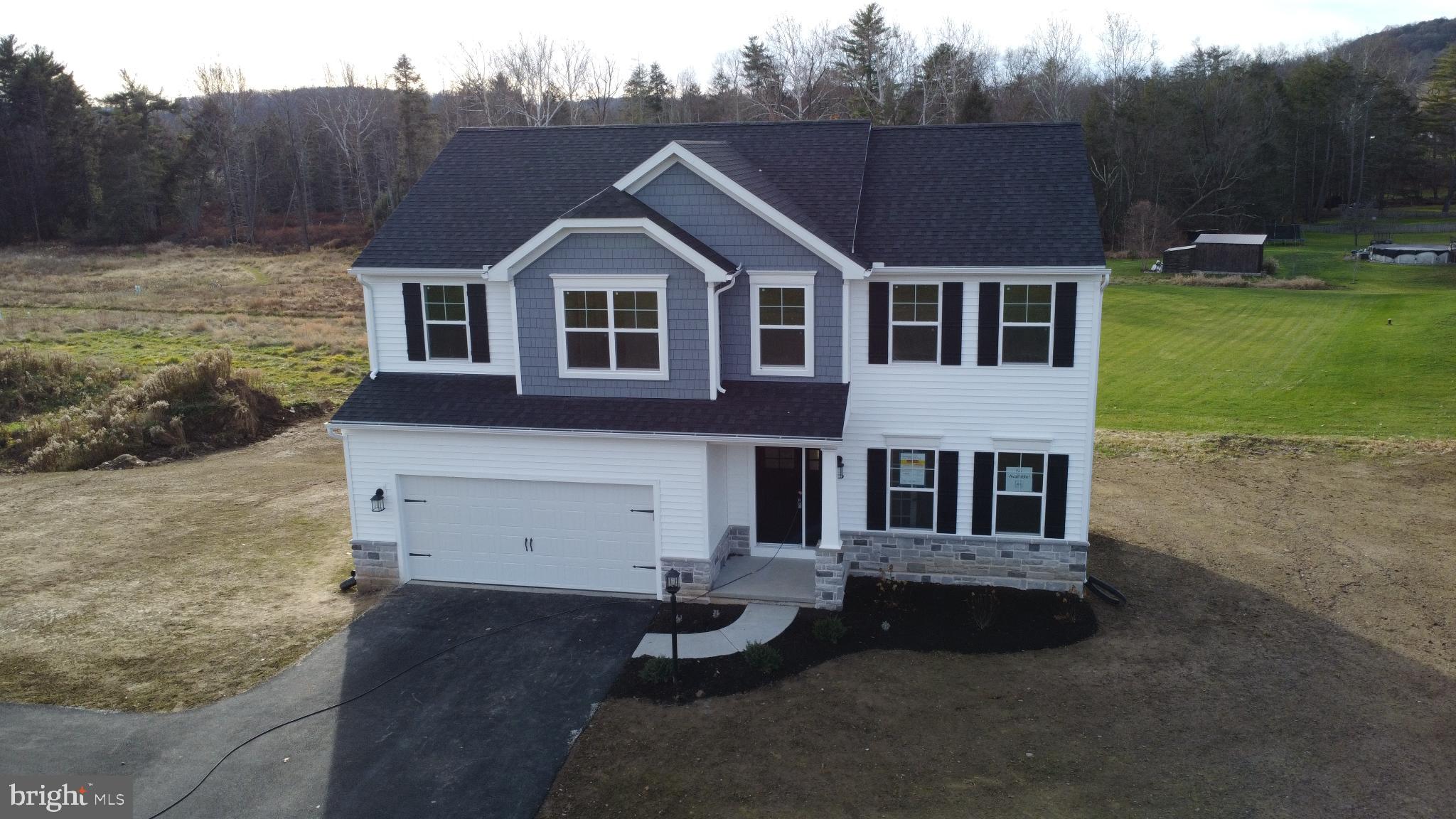 2287 Warrensville Road Montoursville, PA 17754 - Photo 2 of 24 a view of a white house with a yard