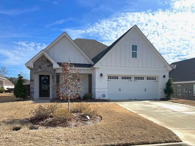 a view of a house with a yard and garage