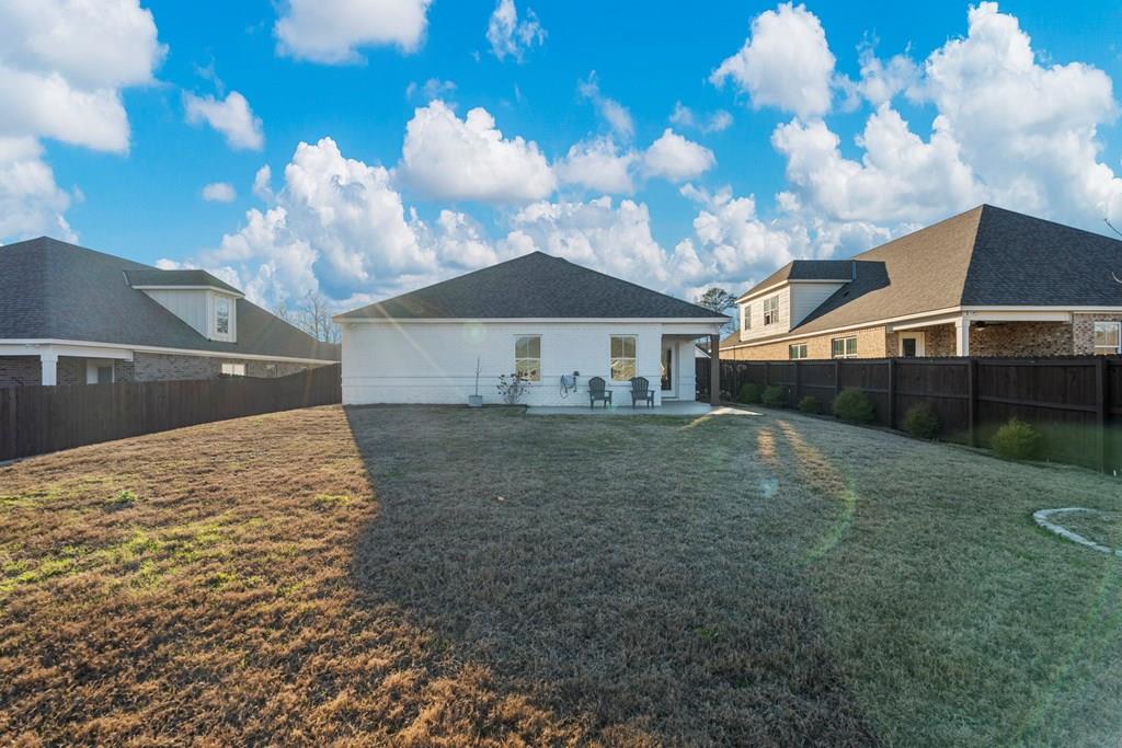 53 Hawthorne Terrace Fortson, GA 31808 - Photo 24 of 38 a view of a house with a backyard