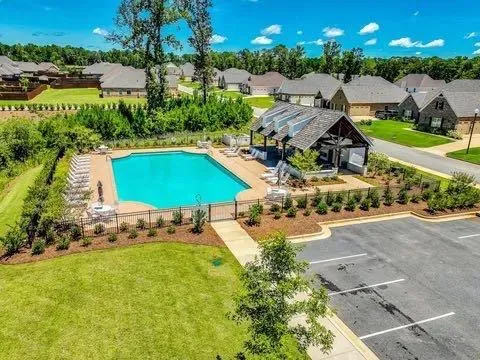 a view of a backyard with chairs
