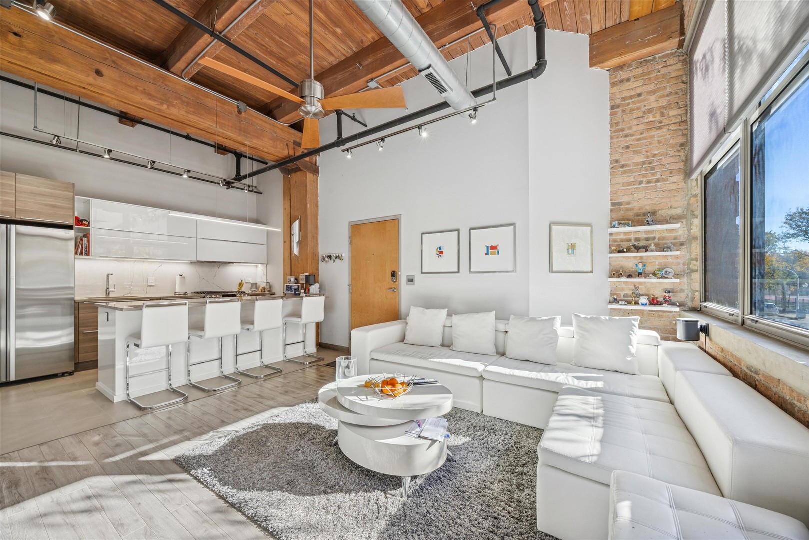 1500 West Monroe Street, Unit 220 Chicago, IL 60607 - Photo 5 of 17 a living room with furniture and a large window