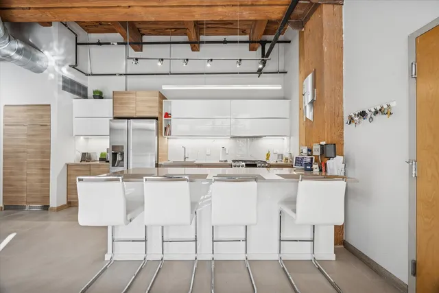 a kitchen with stainless steel appliances granite countertop a sink and cabinets
