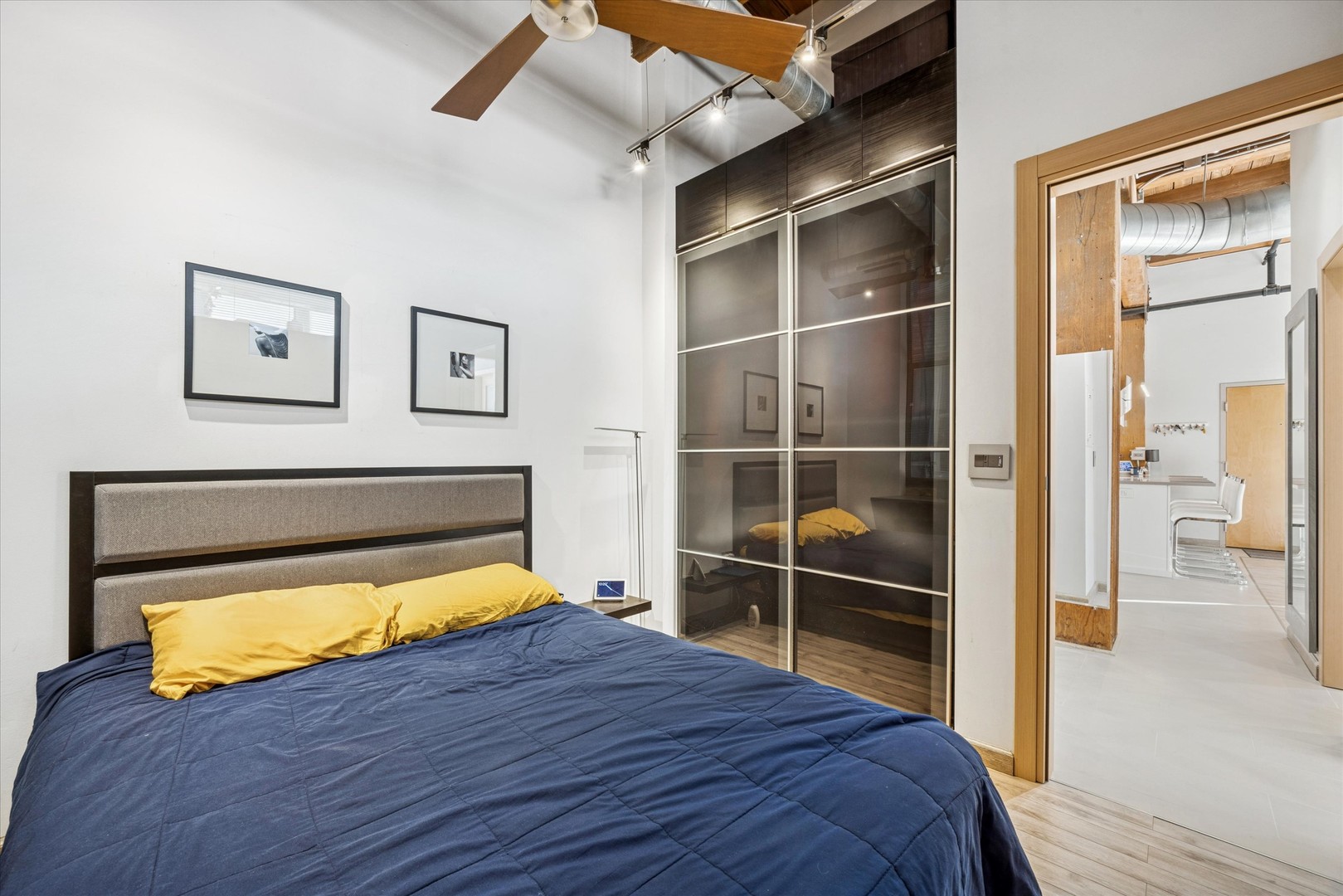 1500 West Monroe Street, Unit 220 Chicago, IL 60607 - Photo 10 of 17 a room with a bed and a view of bathroom