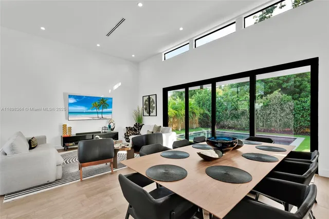 a view of a dining room with furniture wooden floor and a rug