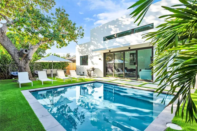 a view of a swimming pool with a patio