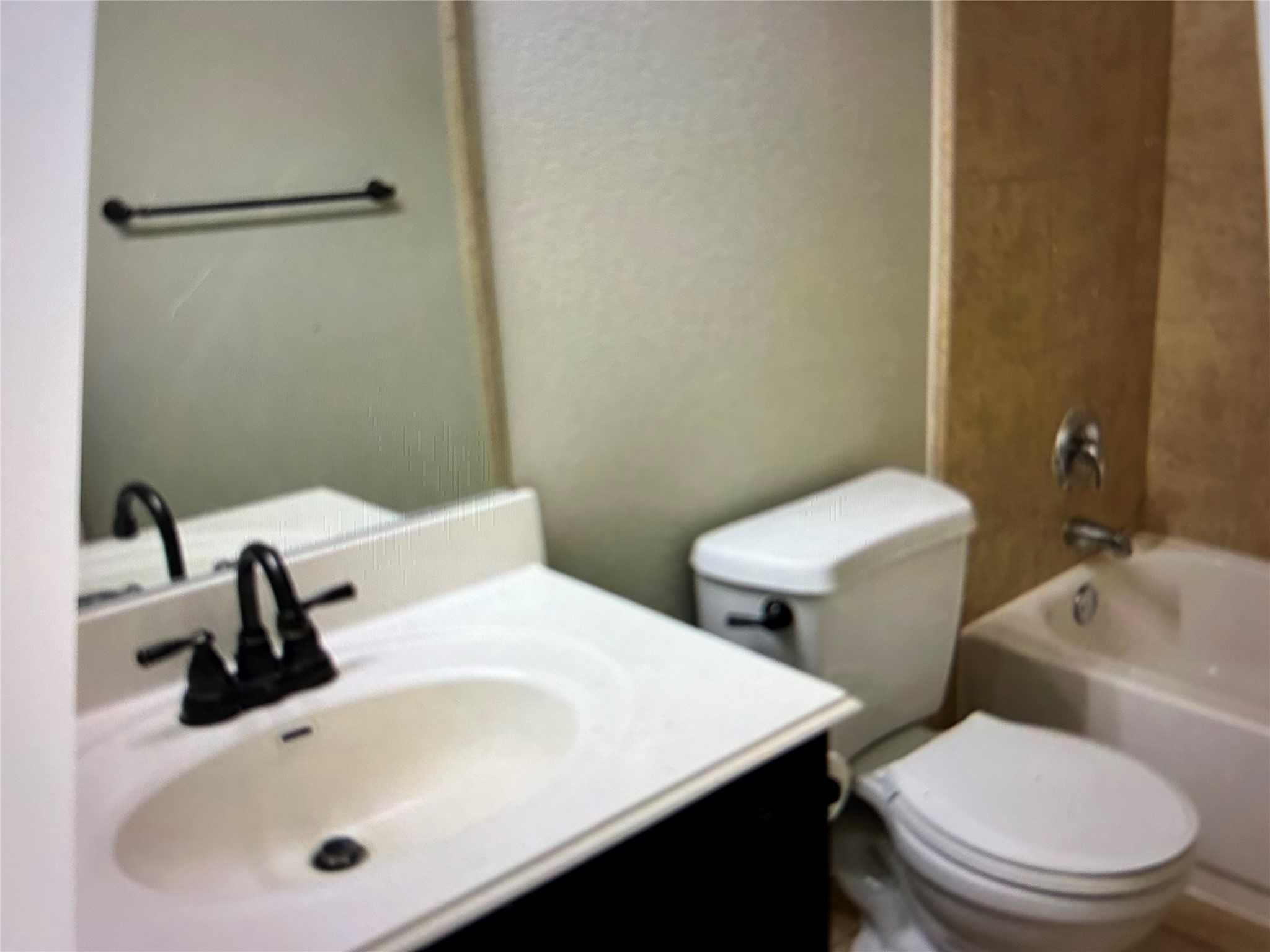 211 Animas Drive Georgetown, TX 78626 - Photo 11 of 25 a bathroom with a toilet sink and mirror