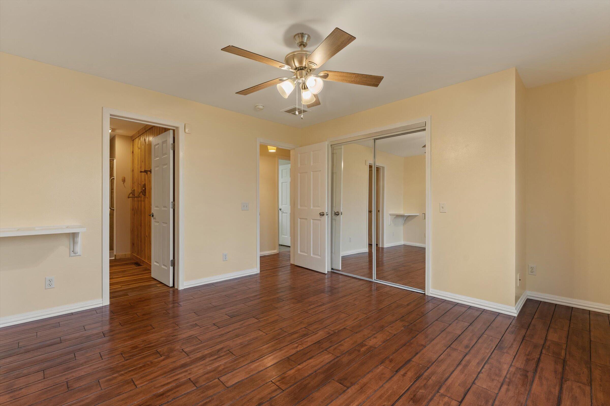 7692 North Emery Road Rolling Prairie, IN 46371 - Photo 22 of 69 a view of an empty room with wooden floor