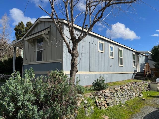 314 South Main Street, Unit 70 Angels Camp, CA 95222 - Photo 1 of 9 a front view of a house with garden