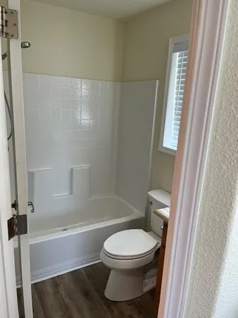 a bathroom with a toilet a sink and a bathtub