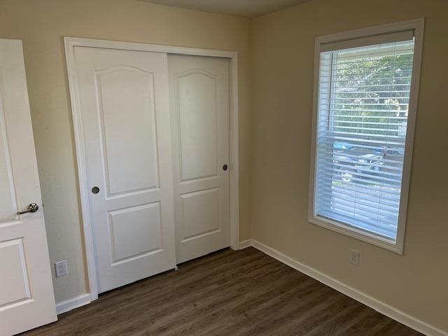 314 South Main Street, Unit 70 Angels Camp, CA 95222 - Photo 5 of 9 a view of an empty room with wooden floor and a window