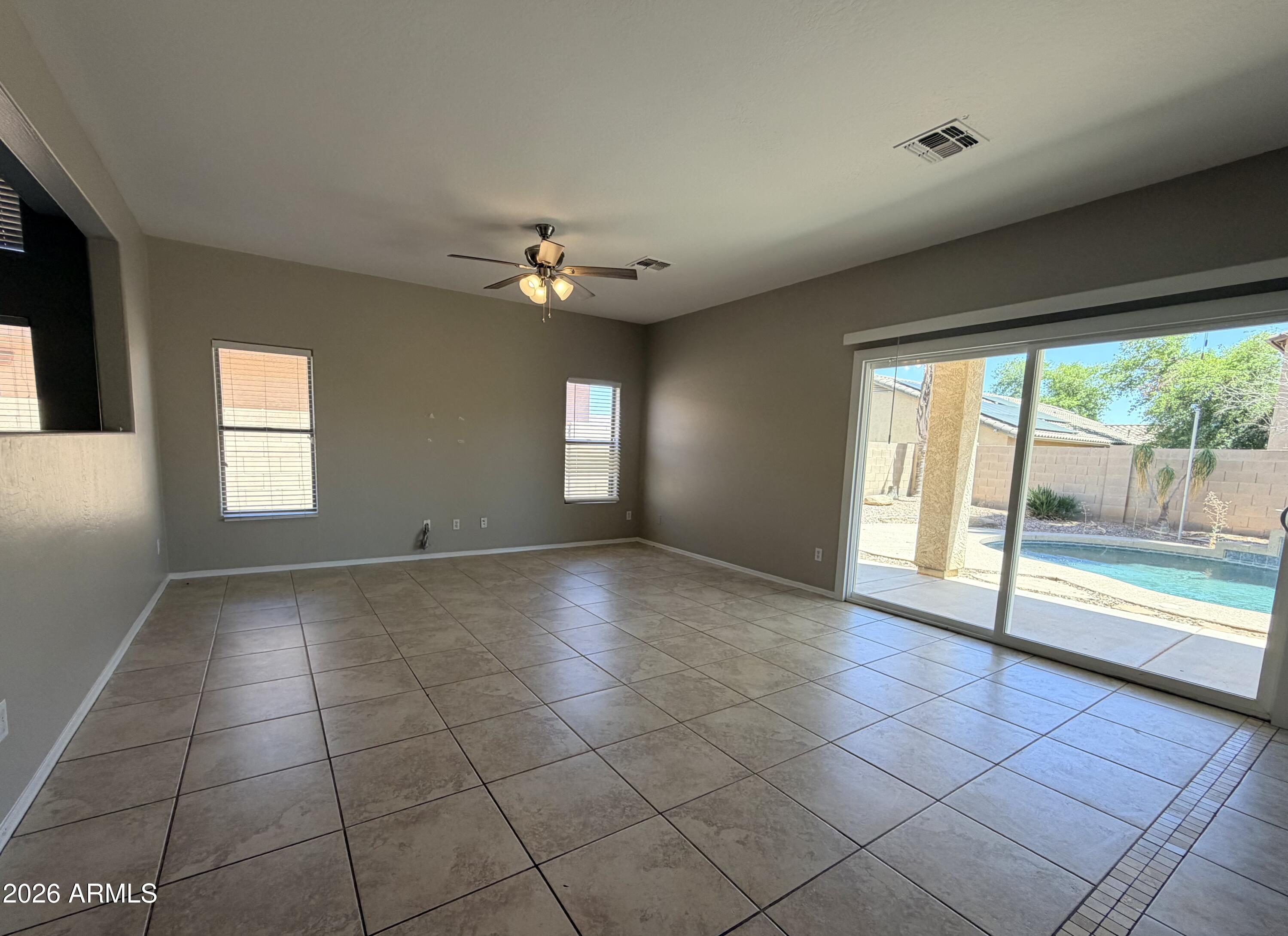 191 West Rio Drive Casa Grande, AZ 85122 - Photo 10 of 34 a view of an empty room with glass door and a window