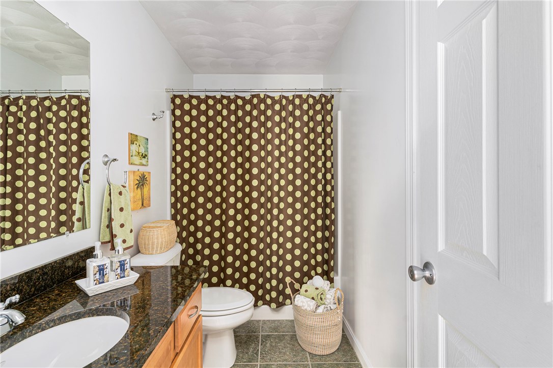 1 Meadow Road Narragansett, RI 02882 - Photo 30 of 50 2nd floor bath with tub/shower, granite counter, tile floor. There is a stack-able washer/dryer behind the door.