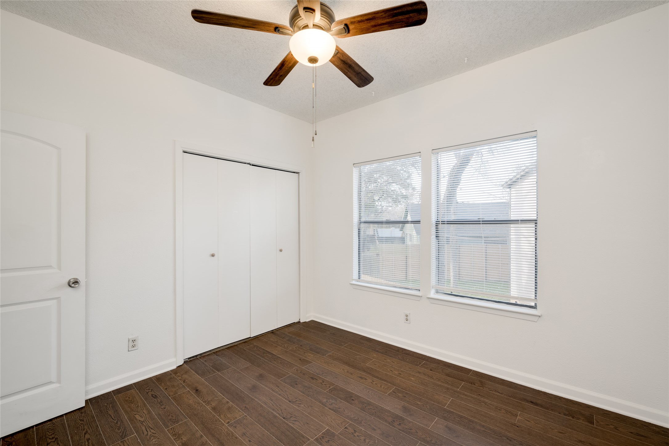 5304 Indio Cove, Unit B Austin, TX 78745 - Photo 22 of 40 a view of empty room with wooden floor and fan