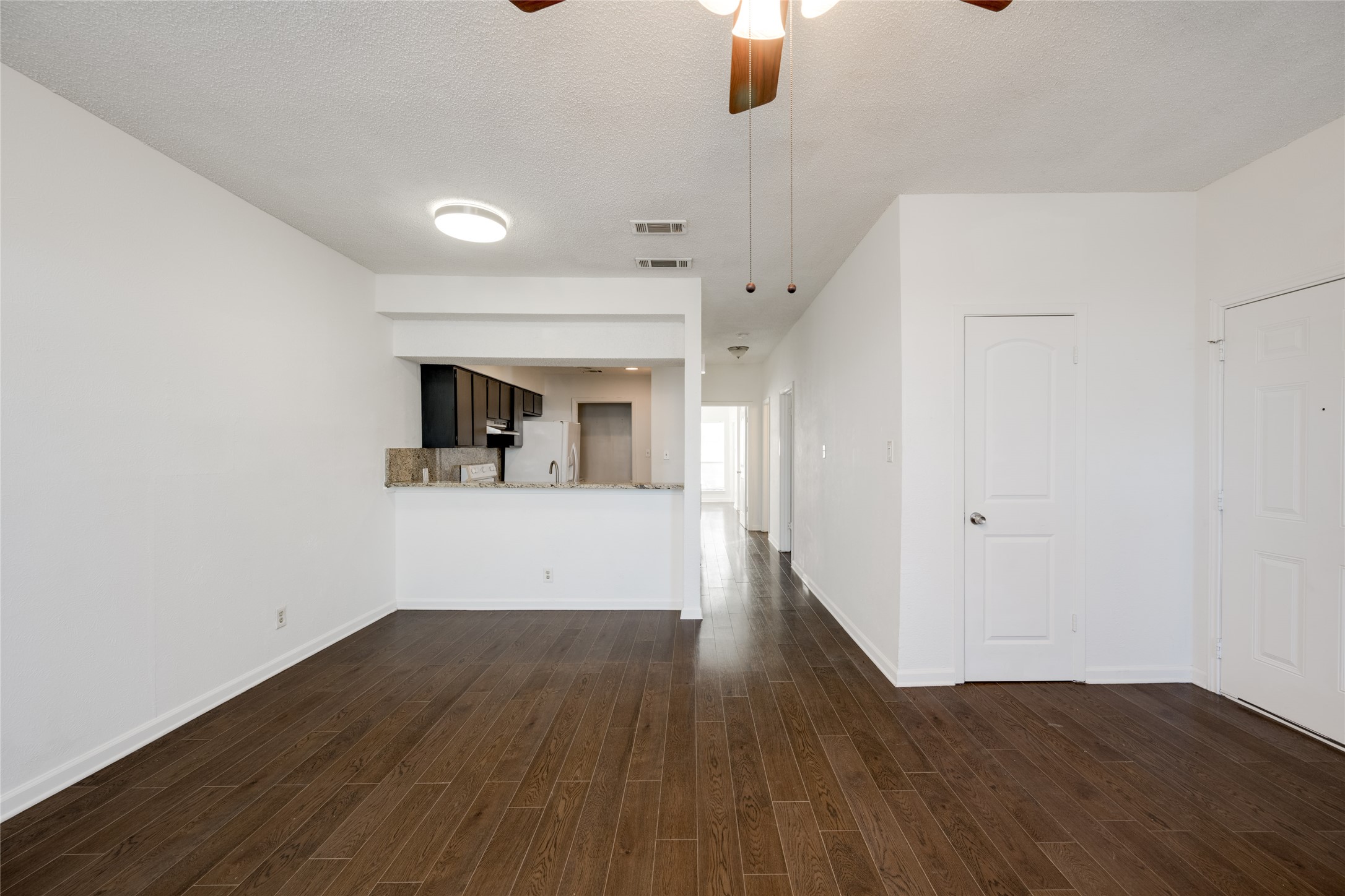 5304 Indio Cove, Unit B Austin, TX 78745 - Photo 3 of 40 a view of a big room with wooden floor and windows