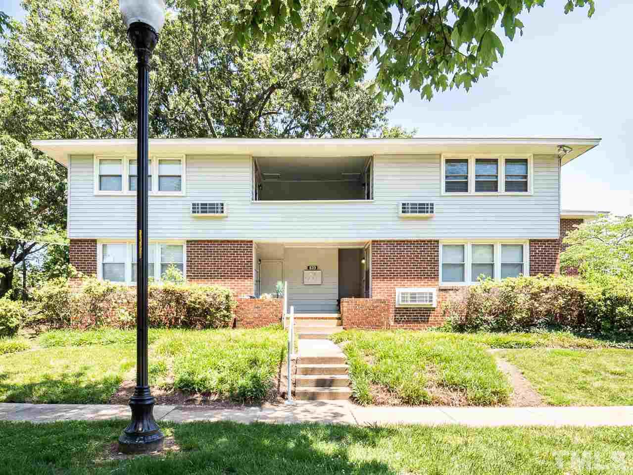 633 Daniels Street, Unit D Raleigh, NC 27605 - Photo 1 of 14 a front view of house with yard