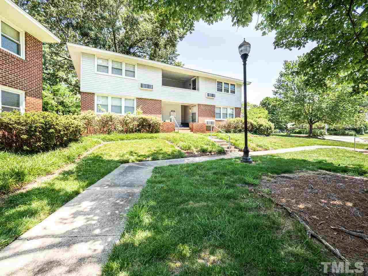 633 Daniels Street, Unit D Raleigh, NC 27605 - Photo 3 of 14 a front view of a house with a yard