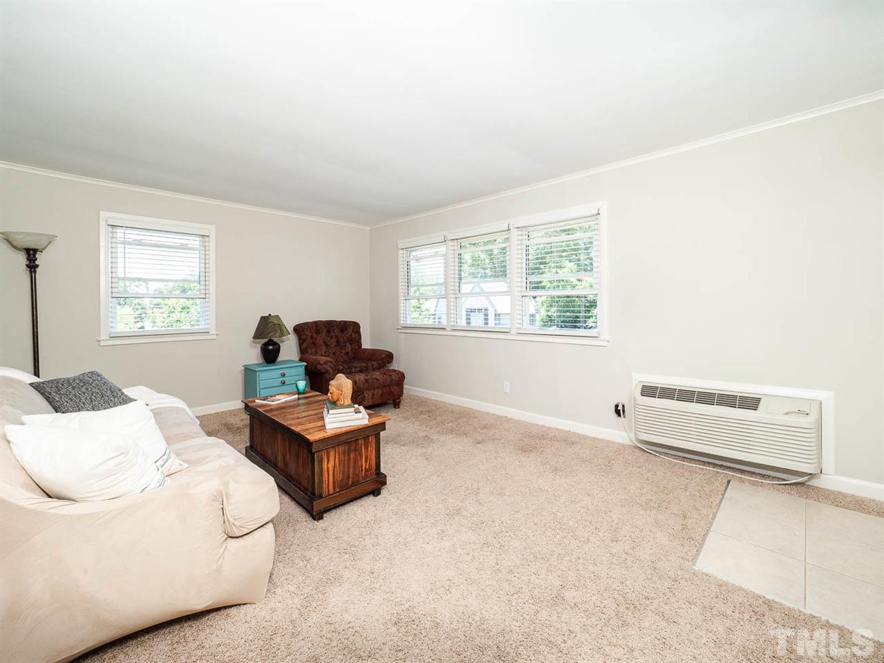 633 Daniels Street, Unit D Raleigh, NC 27605 - Photo 7 of 14 a living room with furniture and window
