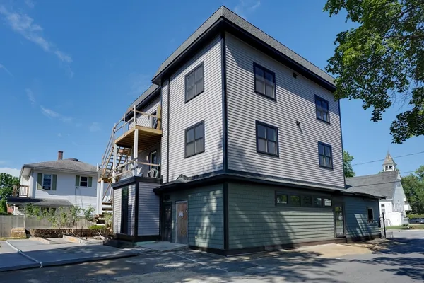a front view of a house with garage