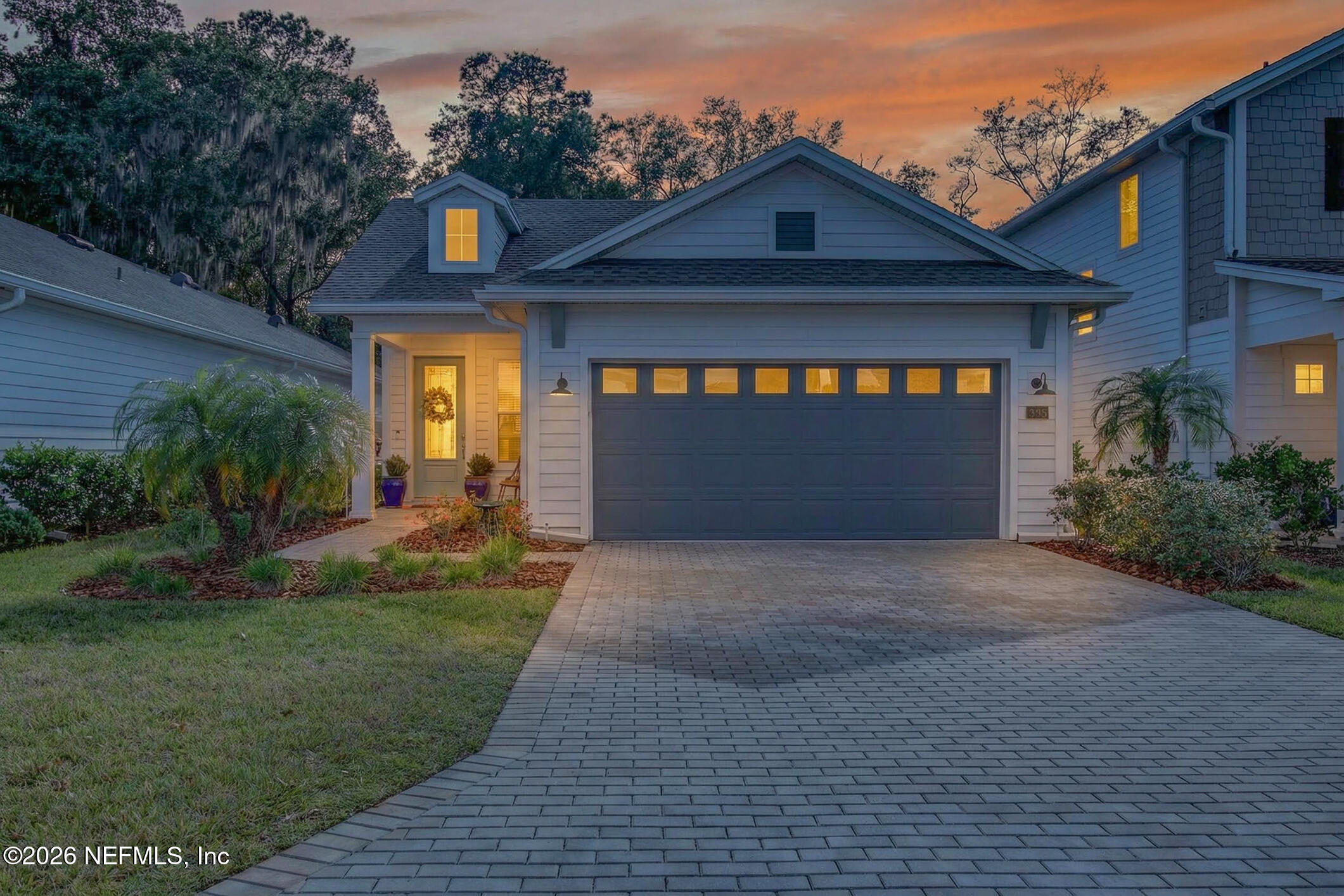 237 Windswept Way Street St. Augustine, FL 32092 - Photo 1 of 136 a front view of a house with a yard and garage