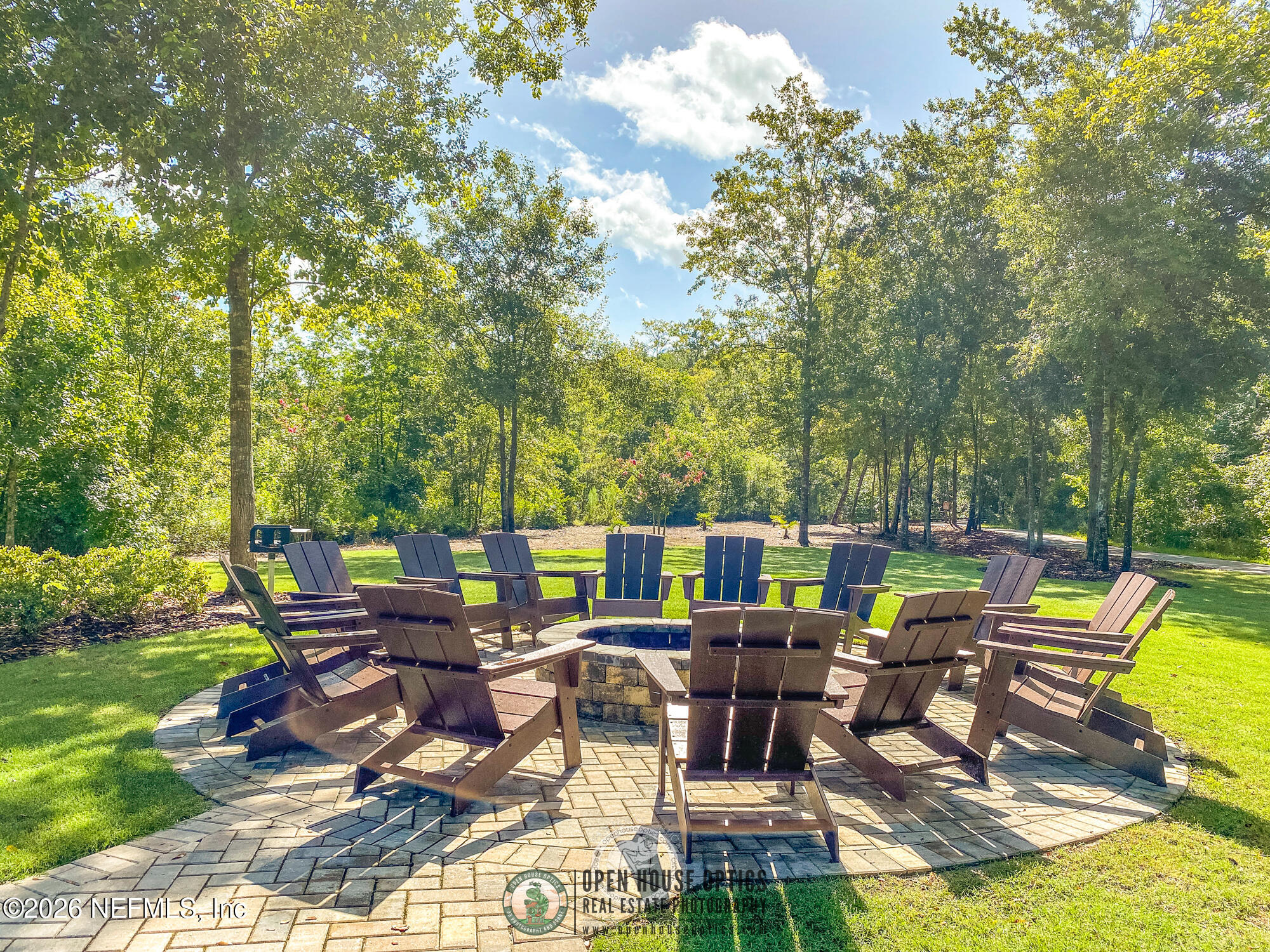 237 Windswept Way Street St. Augustine, FL 32092 - Photo 119 of 136 a view of a patio with table and chairs and floor to ceiling window
