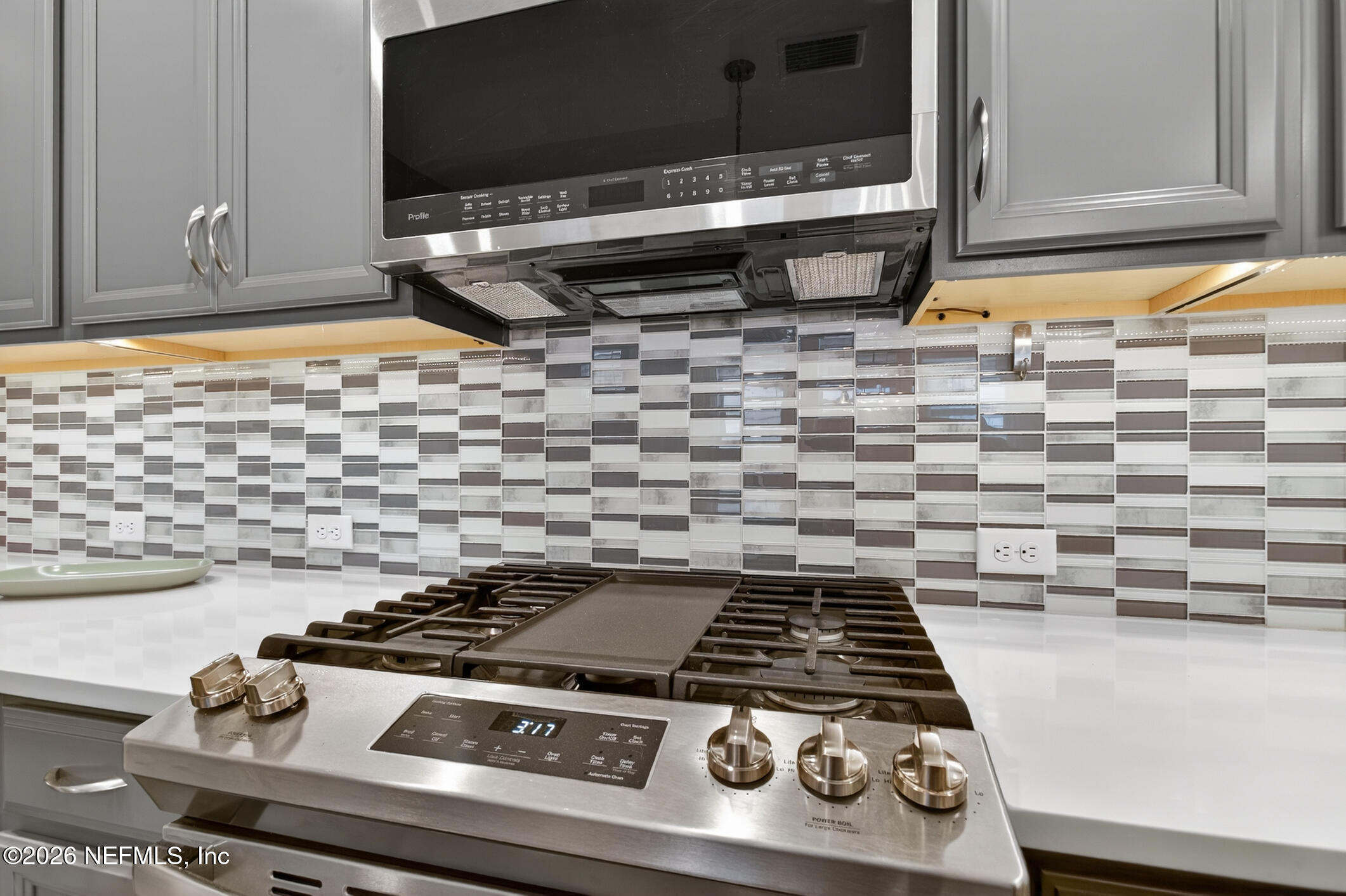 237 Windswept Way Street St. Augustine, FL 32092 - Photo 19 of 136 a stove top oven sitting inside of a kitchen