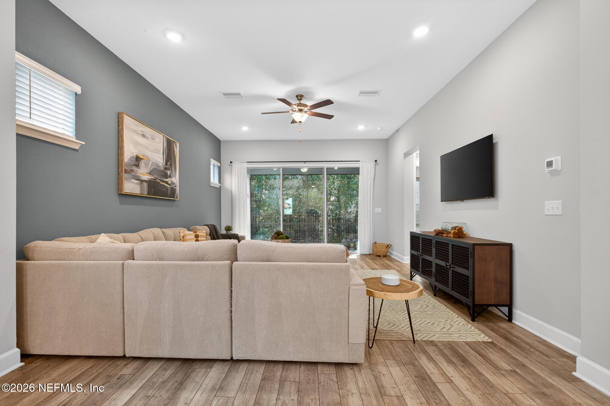 237 Windswept Way Street St. Augustine, FL 32092 - Photo 20 of 136 a living room with furniture and a flat screen tv