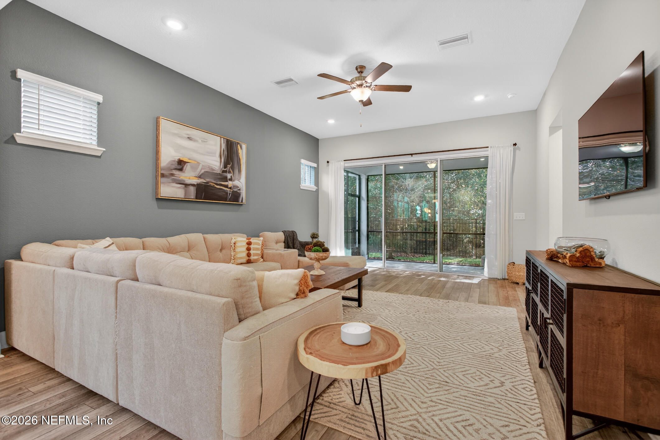 237 Windswept Way Street St. Augustine, FL 32092 - Photo 21 of 136 a living room with furniture and a flat screen tv