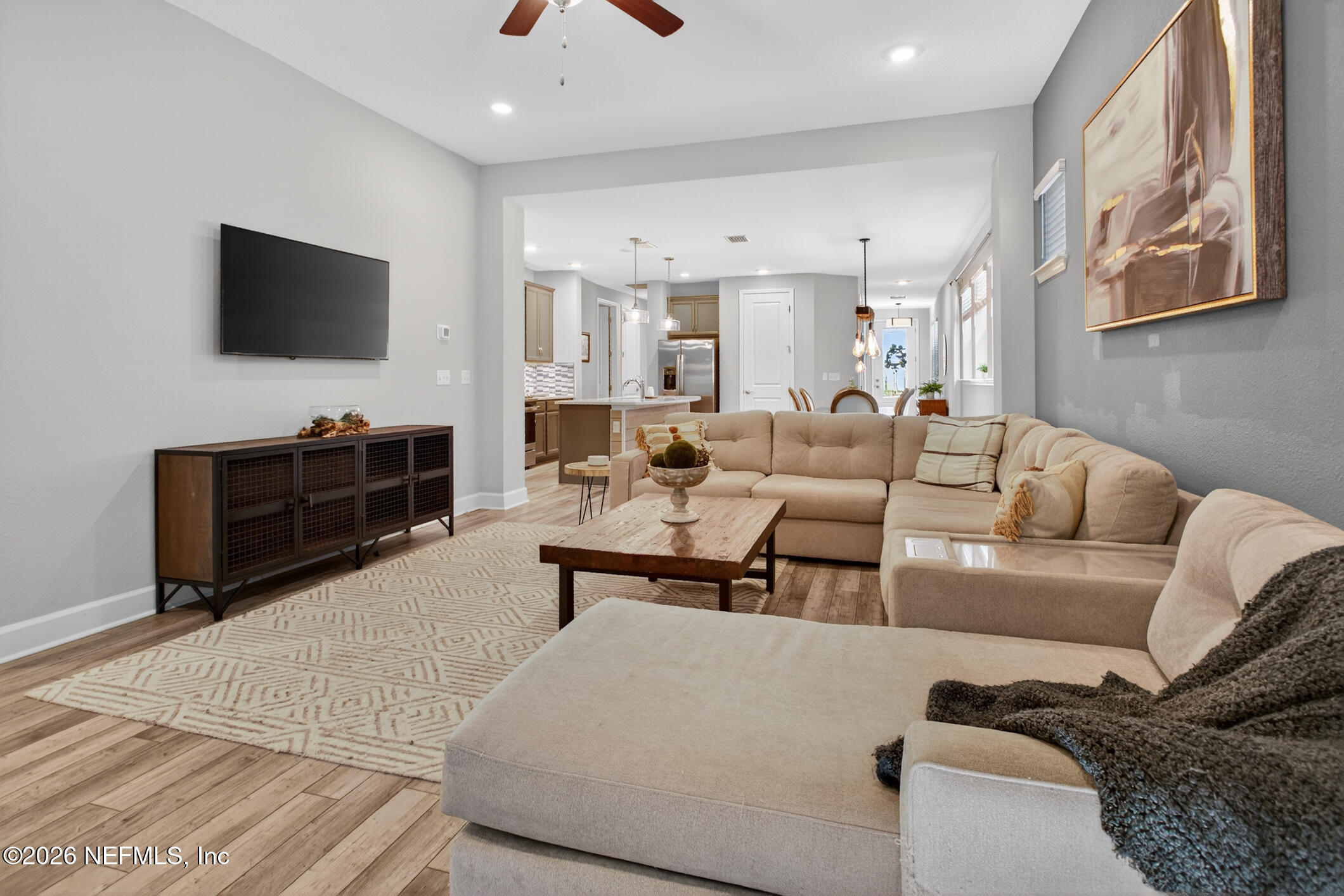 237 Windswept Way Street St. Augustine, FL 32092 - Photo 23 of 136 a living room with furniture and a flat screen tv