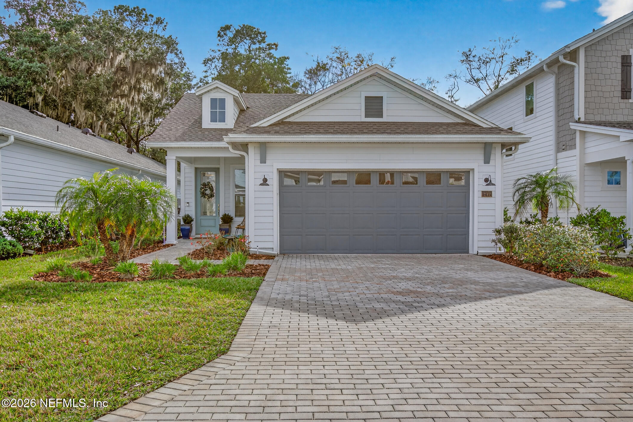 237 Windswept Way Street St. Augustine, FL 32092 - Photo 3 of 136 a front view of a house with a yard and garage