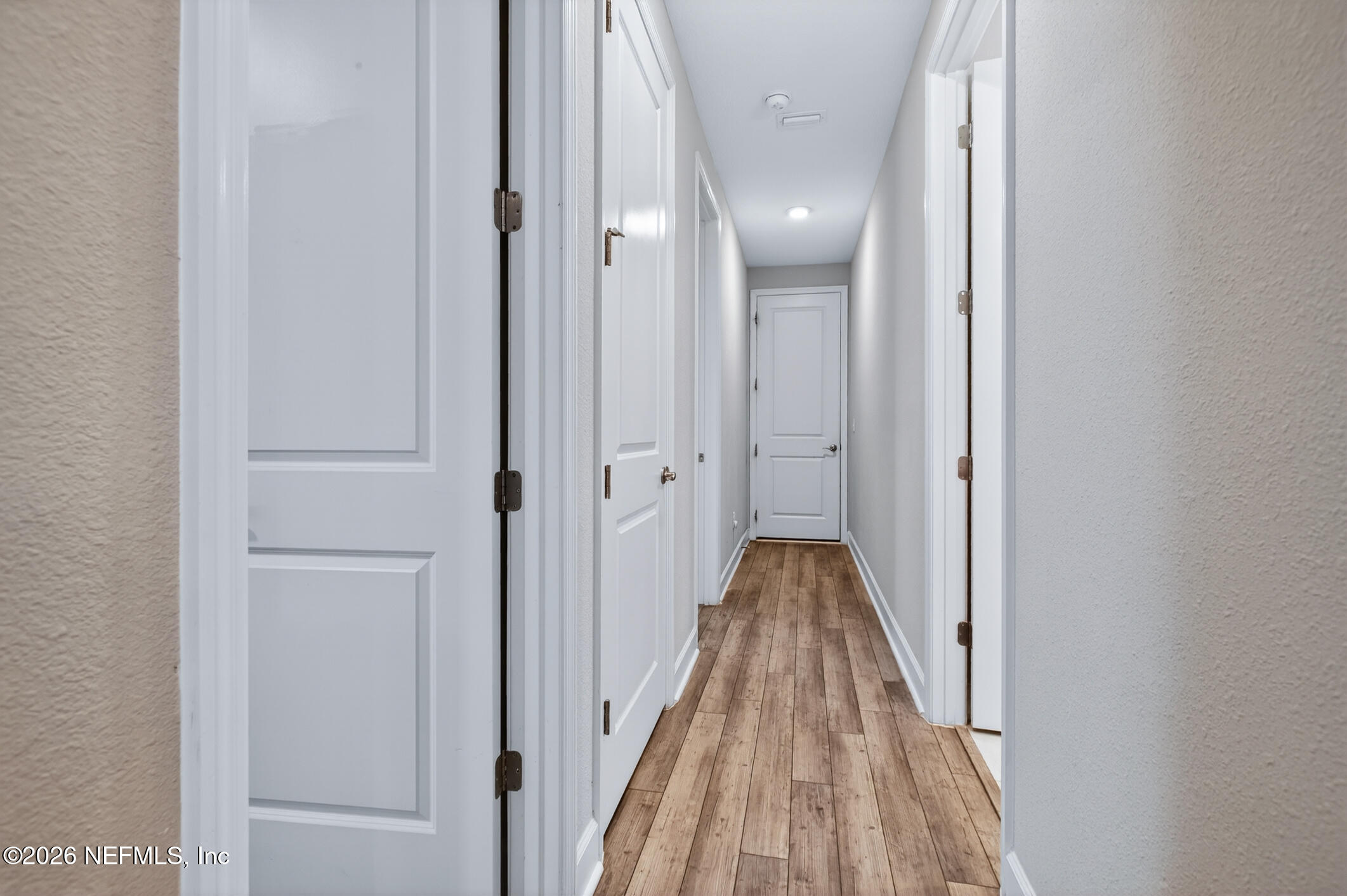 237 Windswept Way Street St. Augustine, FL 32092 - Photo 34 of 136 a view of a hallway with wooden floor and a bathroom